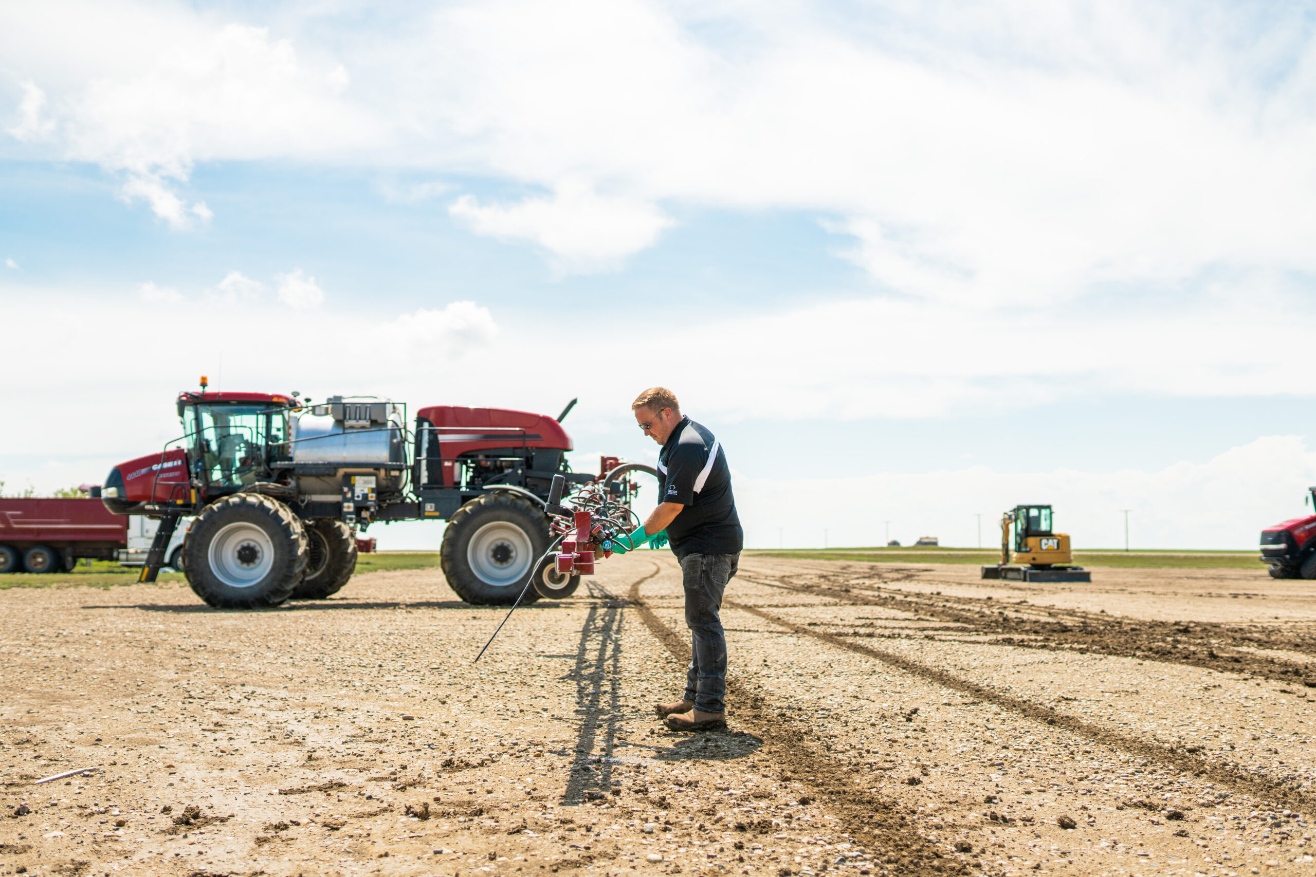 Farmer working on sprayer